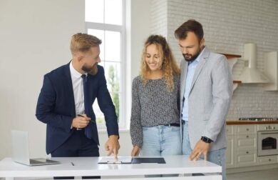 couple reviewing home options with realtor